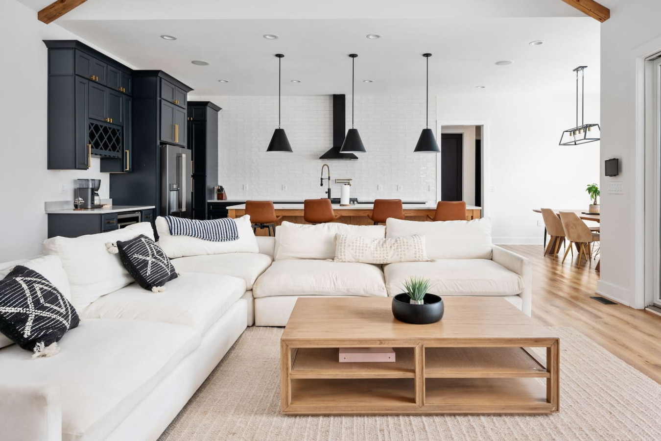 Bright open-concept living room and kitchen in a Villa Lux home